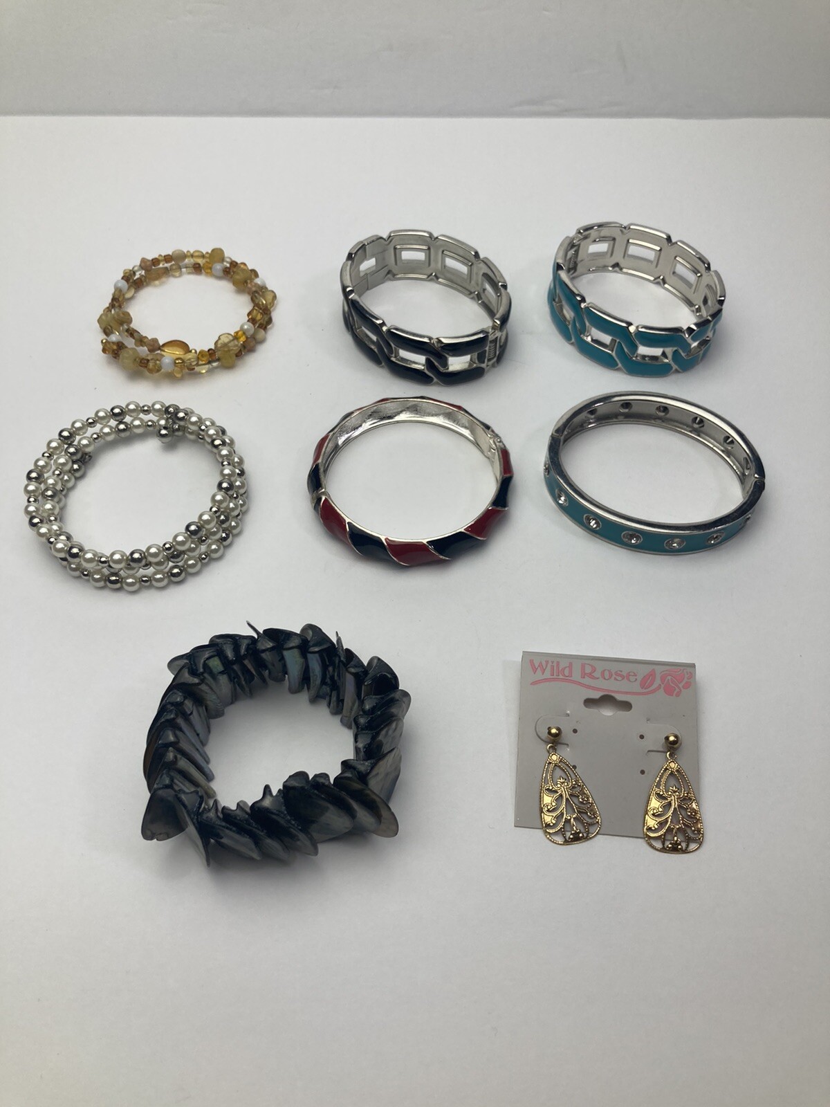 7 Bracelets And 1 Set of Earrings