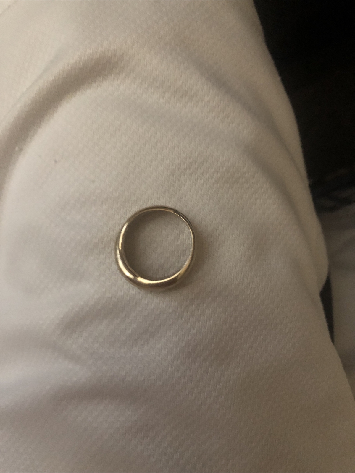 ALL SILVER RING, NOT SURE OF SIZE, CONFIRMED BY A JEWLERY STORE