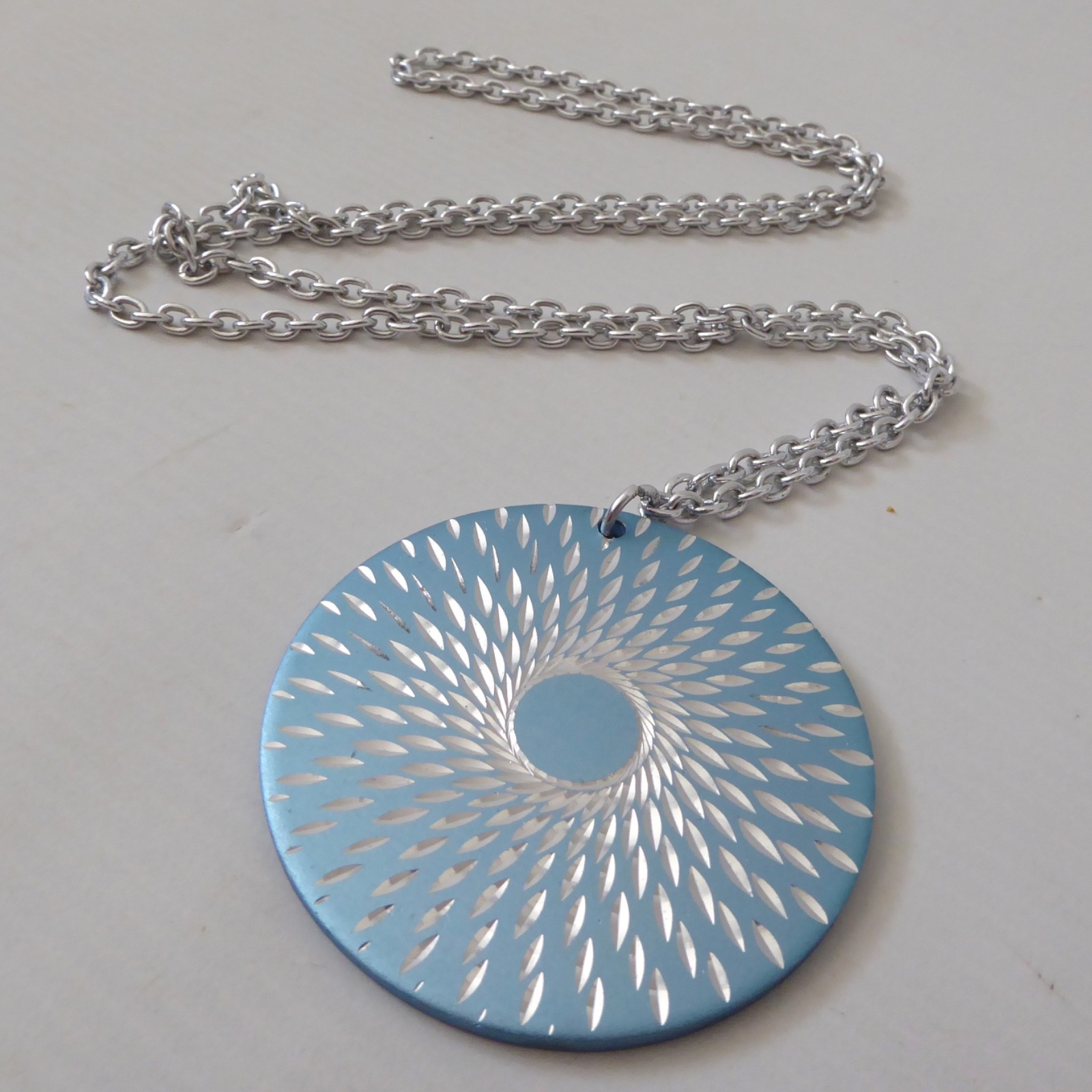 Conrah cristillium pendant necklace. Aluminium anodised blue metal. Geometric