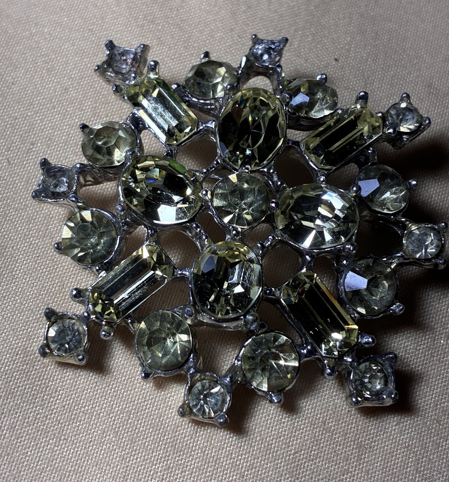 Vintage Pale Olivine Rhinestone Snowflake Brooch