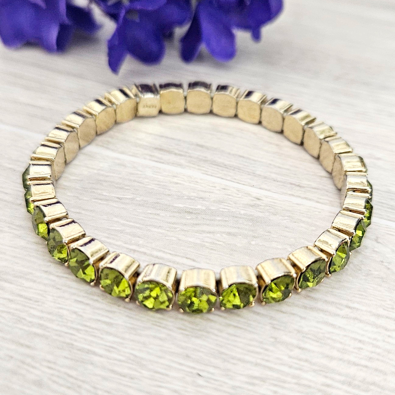 MONET Signed Gold Tone Green Rhinestone Stretch Tennis Bracelet