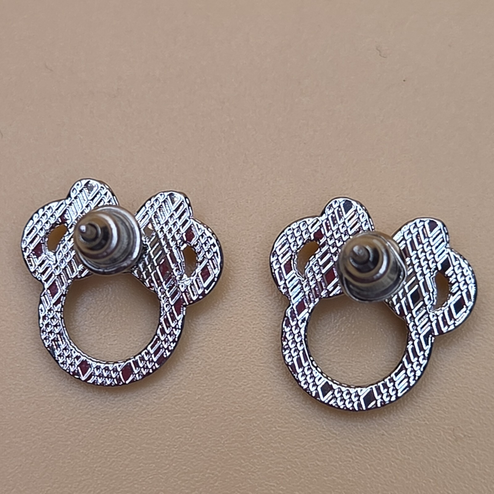 Silver and Rose Tone Ear And Bow Stud Earrings with Butterfly Back Closure
