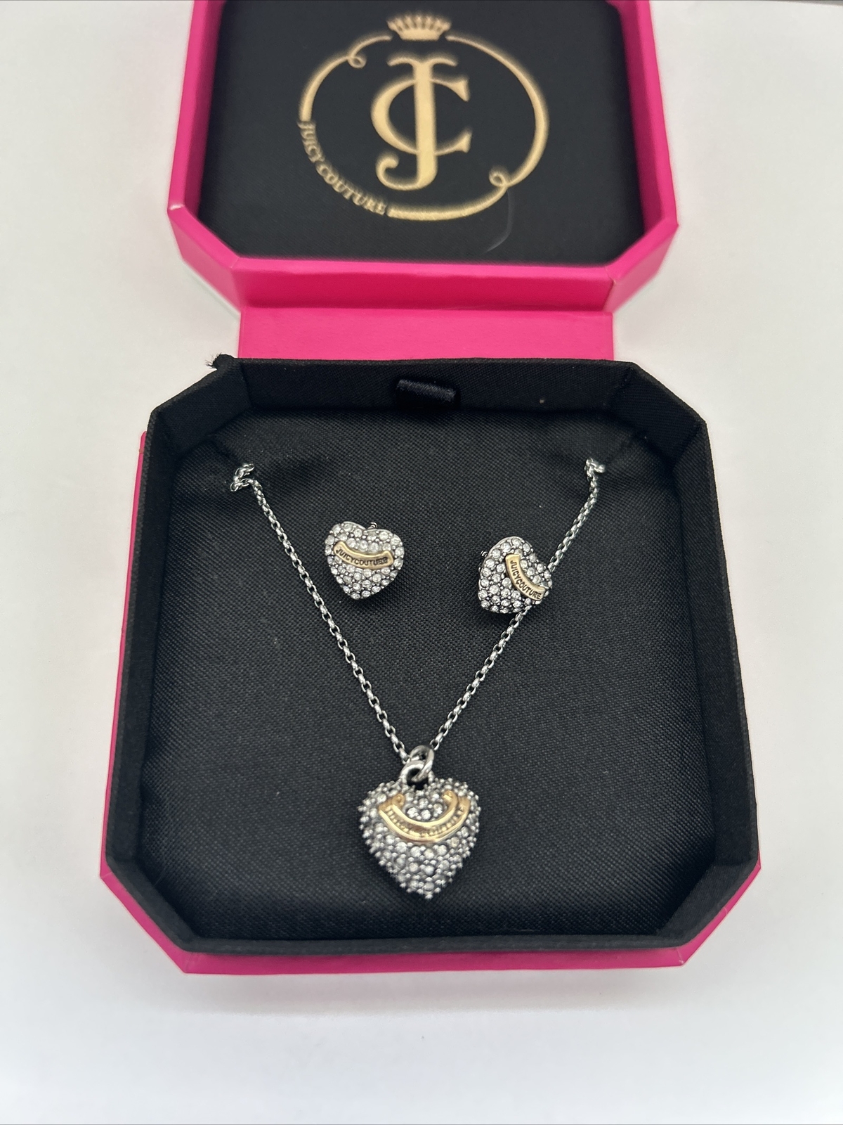 juicy couture necklace/earrings.slightly used. silver heart earrings included.