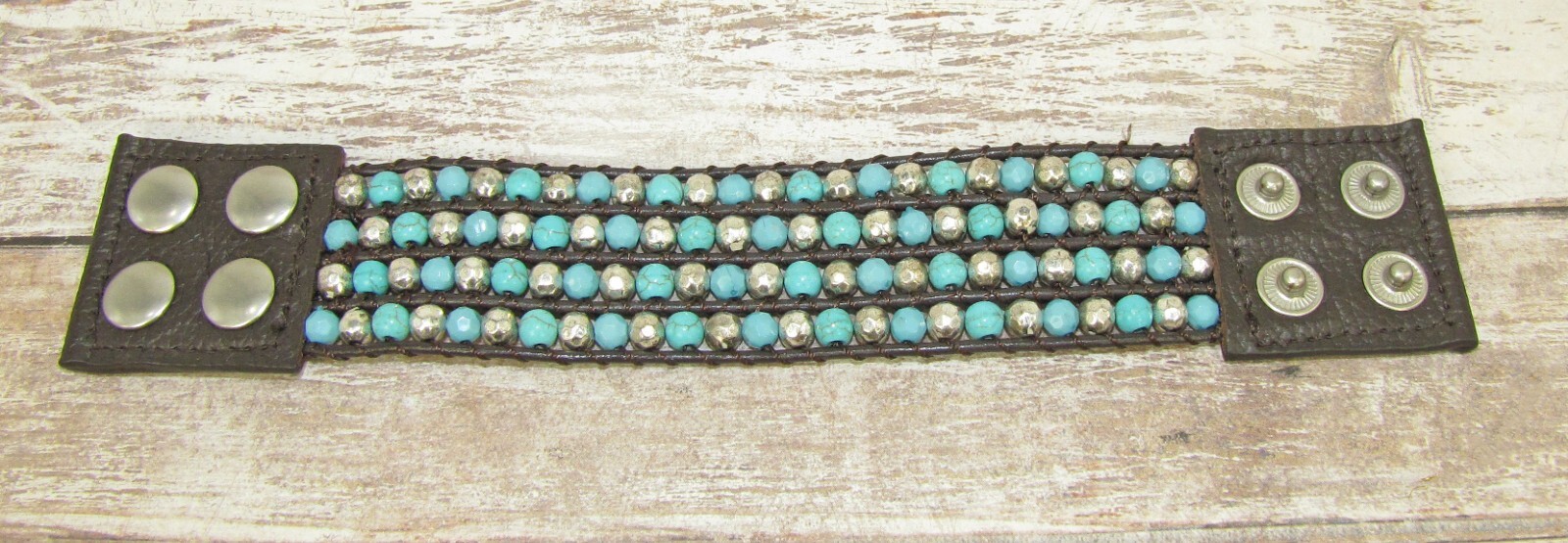 Wide turquoise and silver beaded leather bracelet , snap closure, brown leather