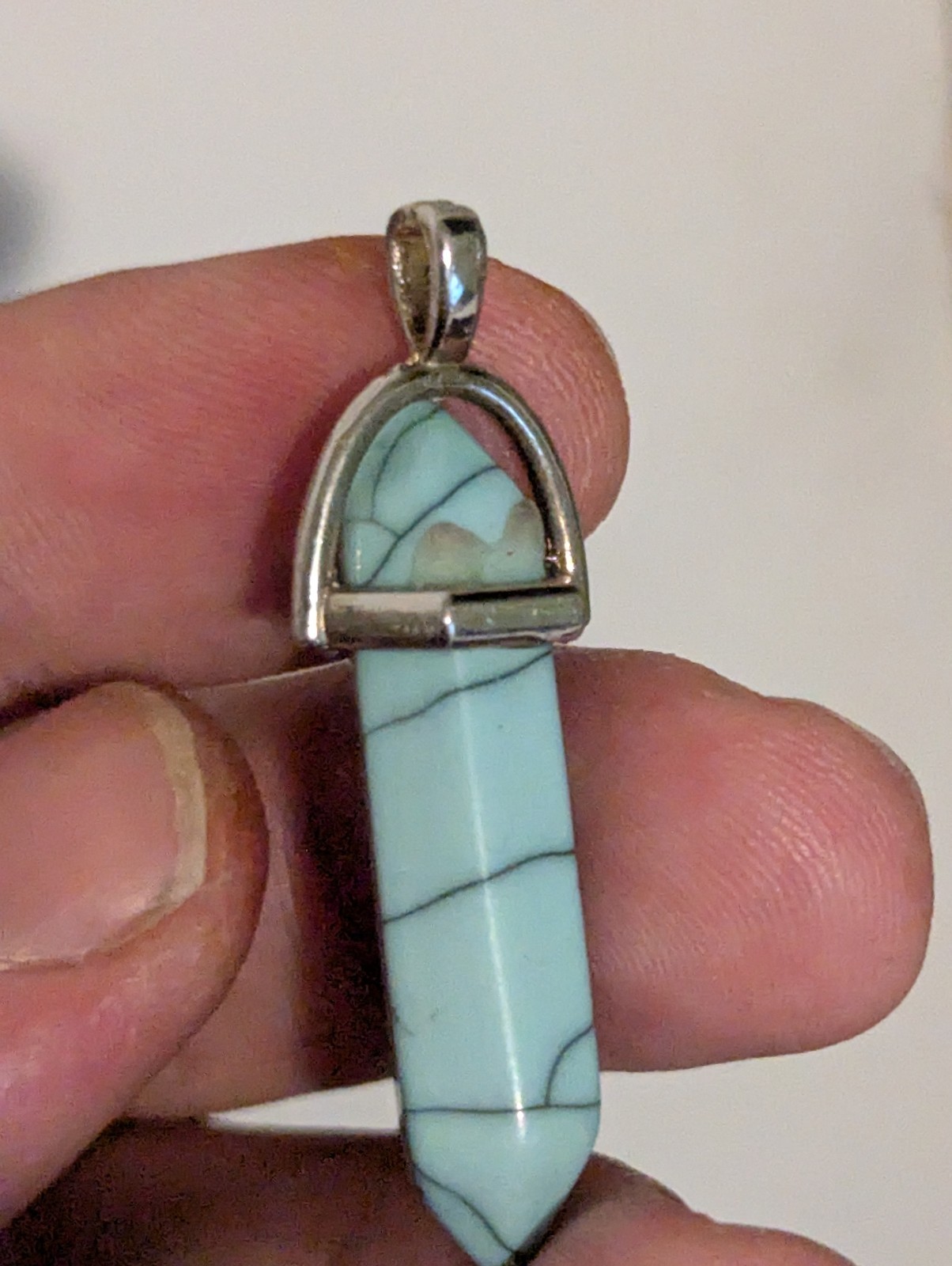 A Turquoise Colored Elongated Pendant (I’m Sure It’s Probably Not Real Turquoise