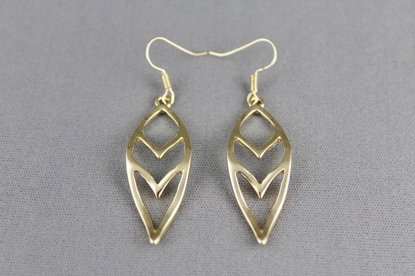 gold tone teardrop dangle earrings chevron V pattern 2.25 inches long liteweight