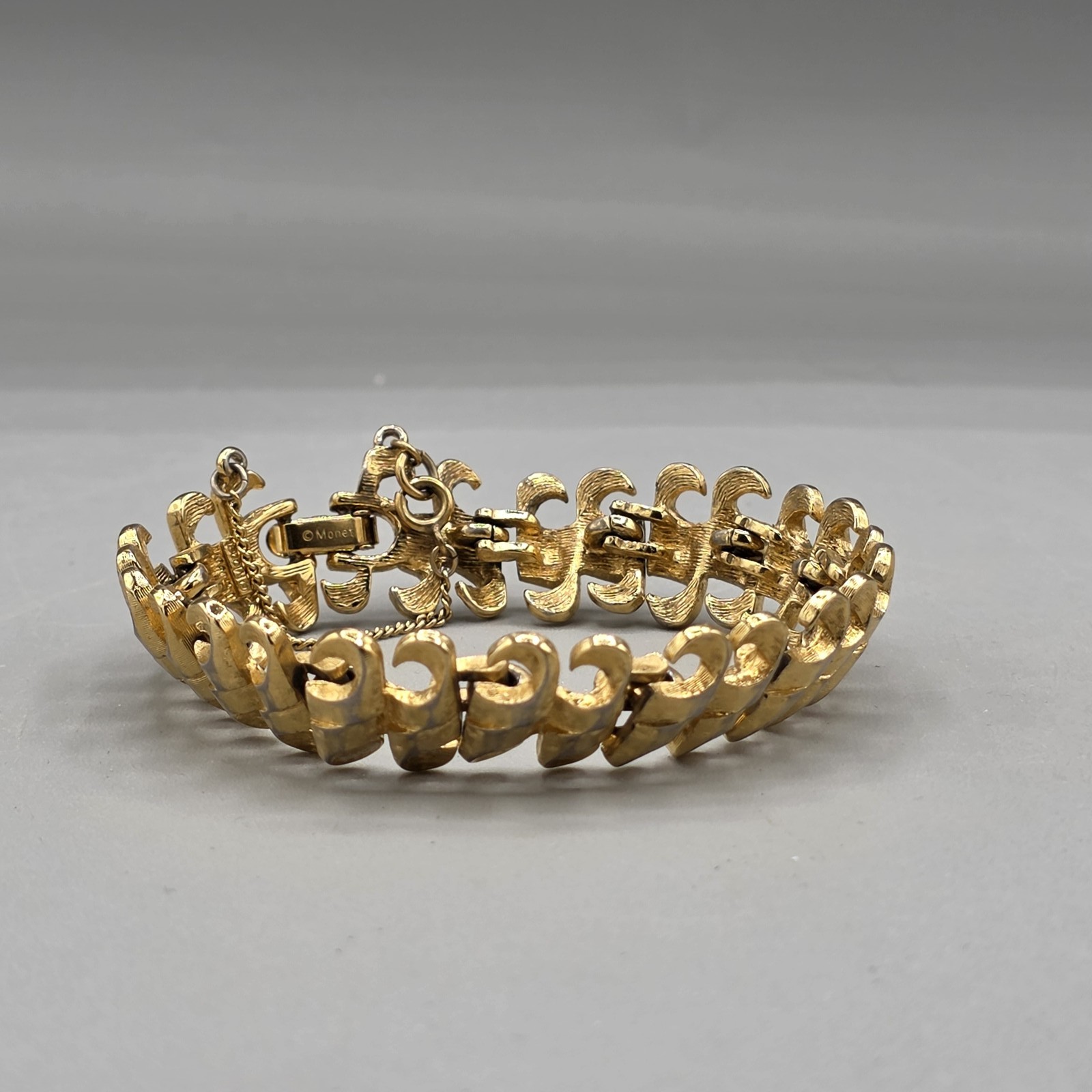 Vintage Monet Gold Tone Textured Link Panel Bracelet Fold Over Clasp