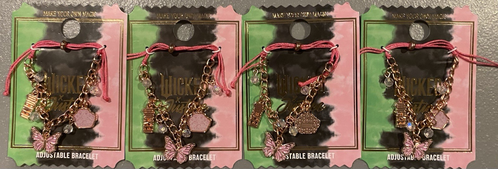 LOT OF 4 WICKED FOR GOOD MOVIE BRACELETS ADJUSTABLE PINK STRING CHARMS GLINDA