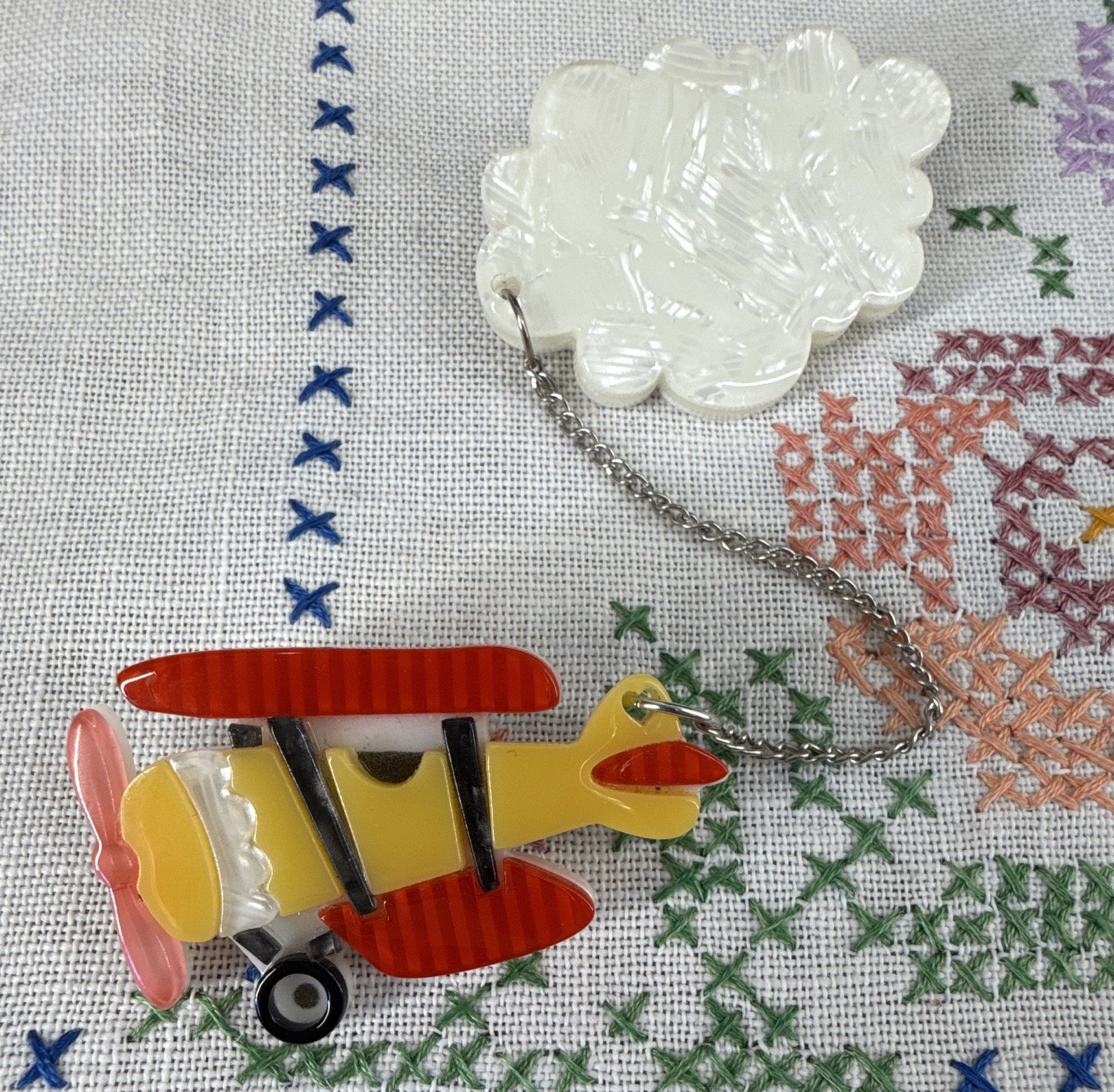Erstwilder Airplane Brooch Pin Chain Signed Multicolor Transportation Theme