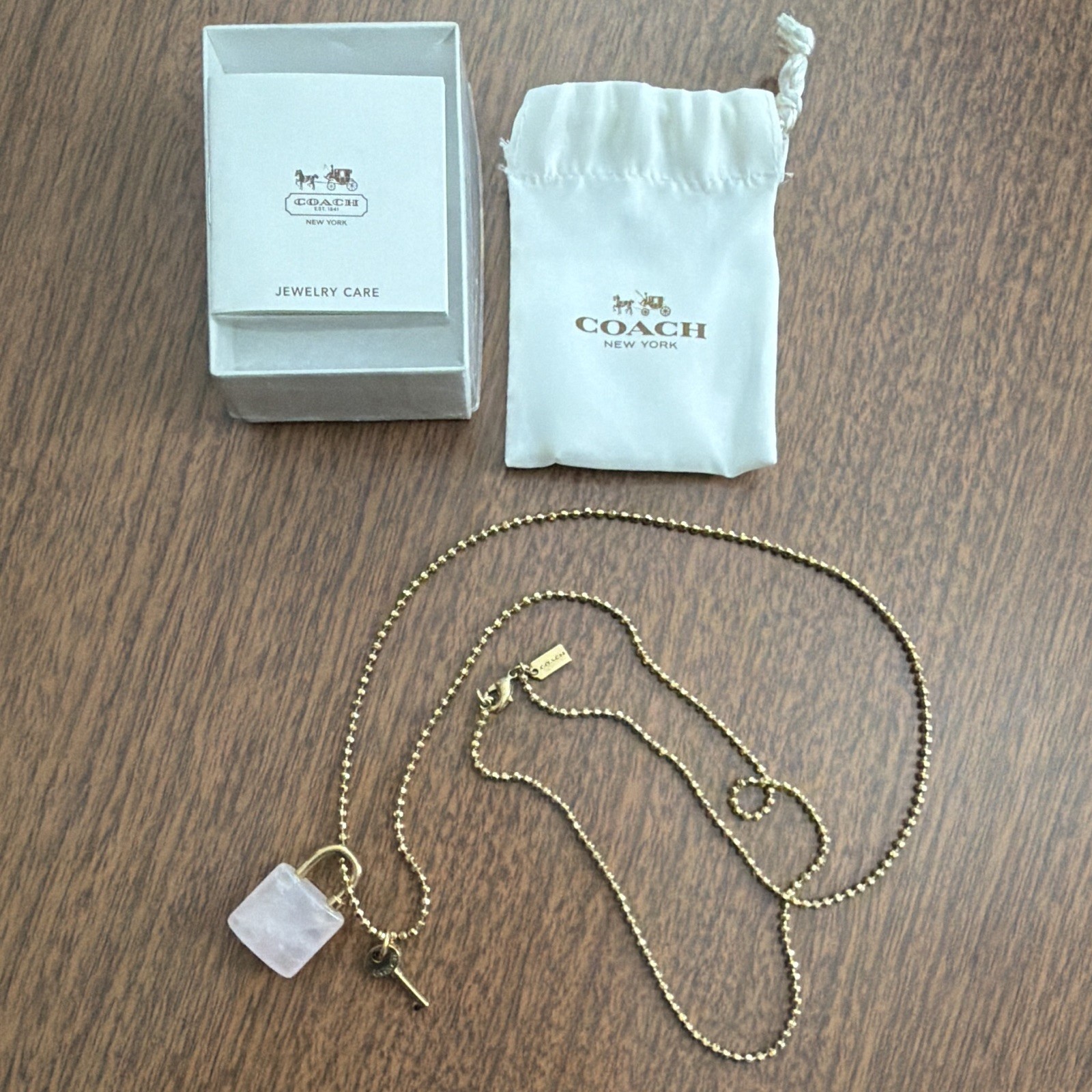 Coach Gold Plated Ball Chain Necklace Rose Quartz Padlock Pendant