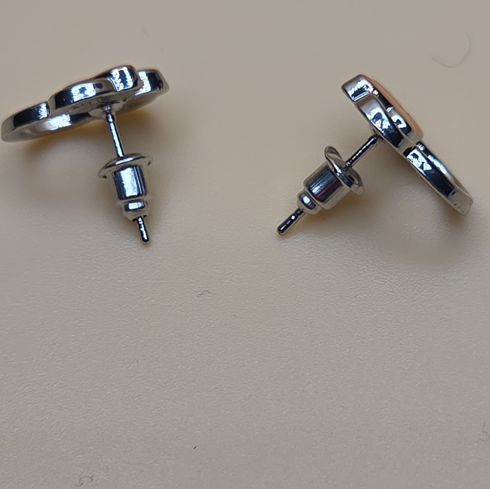 Silver and Rose Tone Ear And Bow Stud Earrings with Butterfly Back Closure