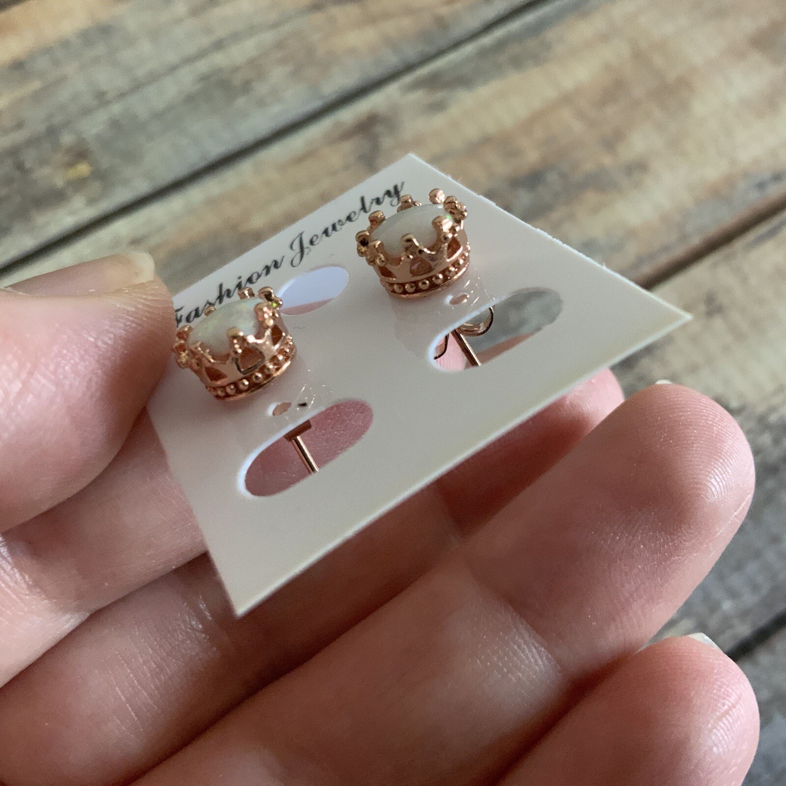 Man made faux opal crown setting rose gold colored stud earrings
