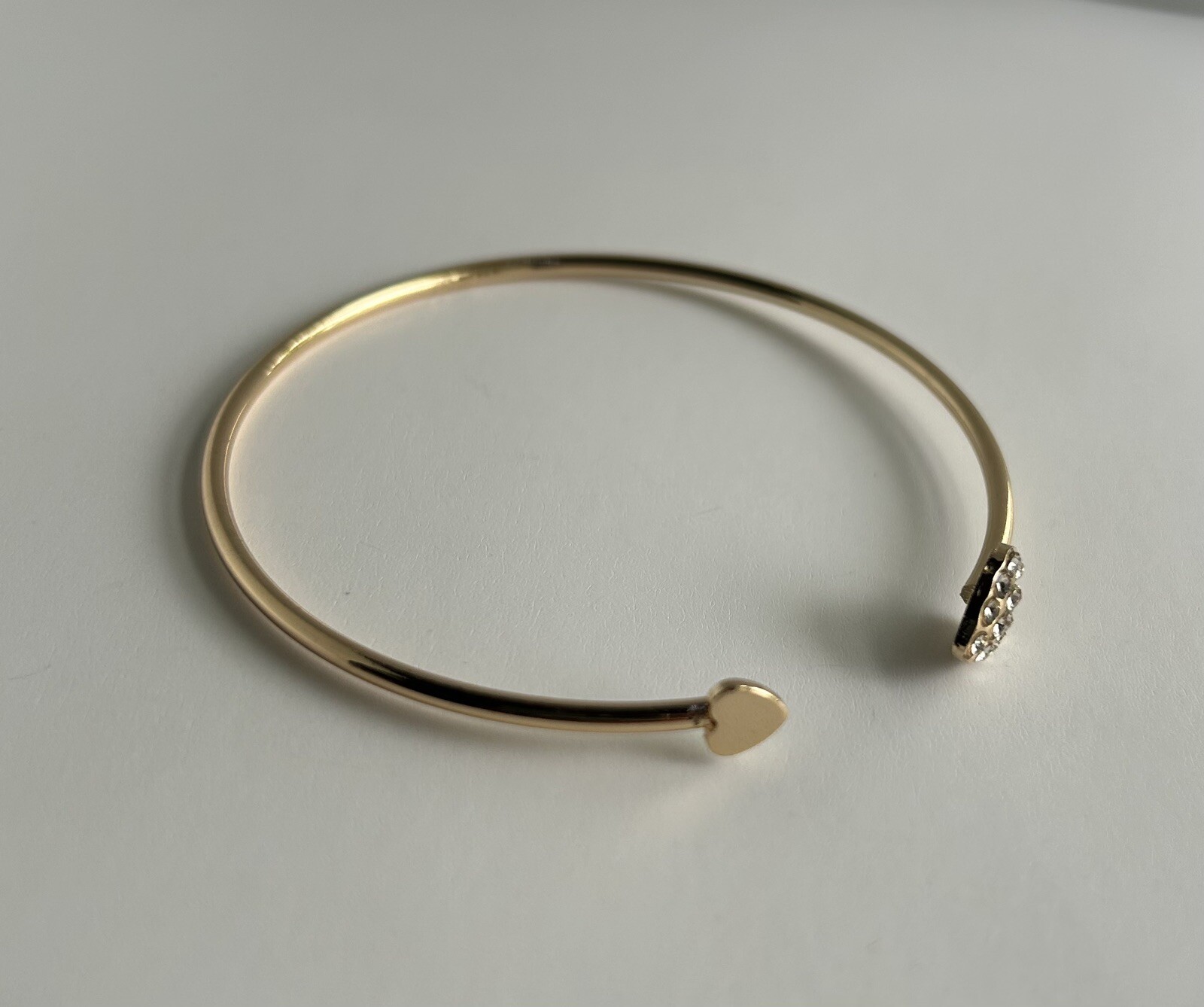Gold Tone Open Cuff Bracelet (Bangle Style) with CZ Heart Ends