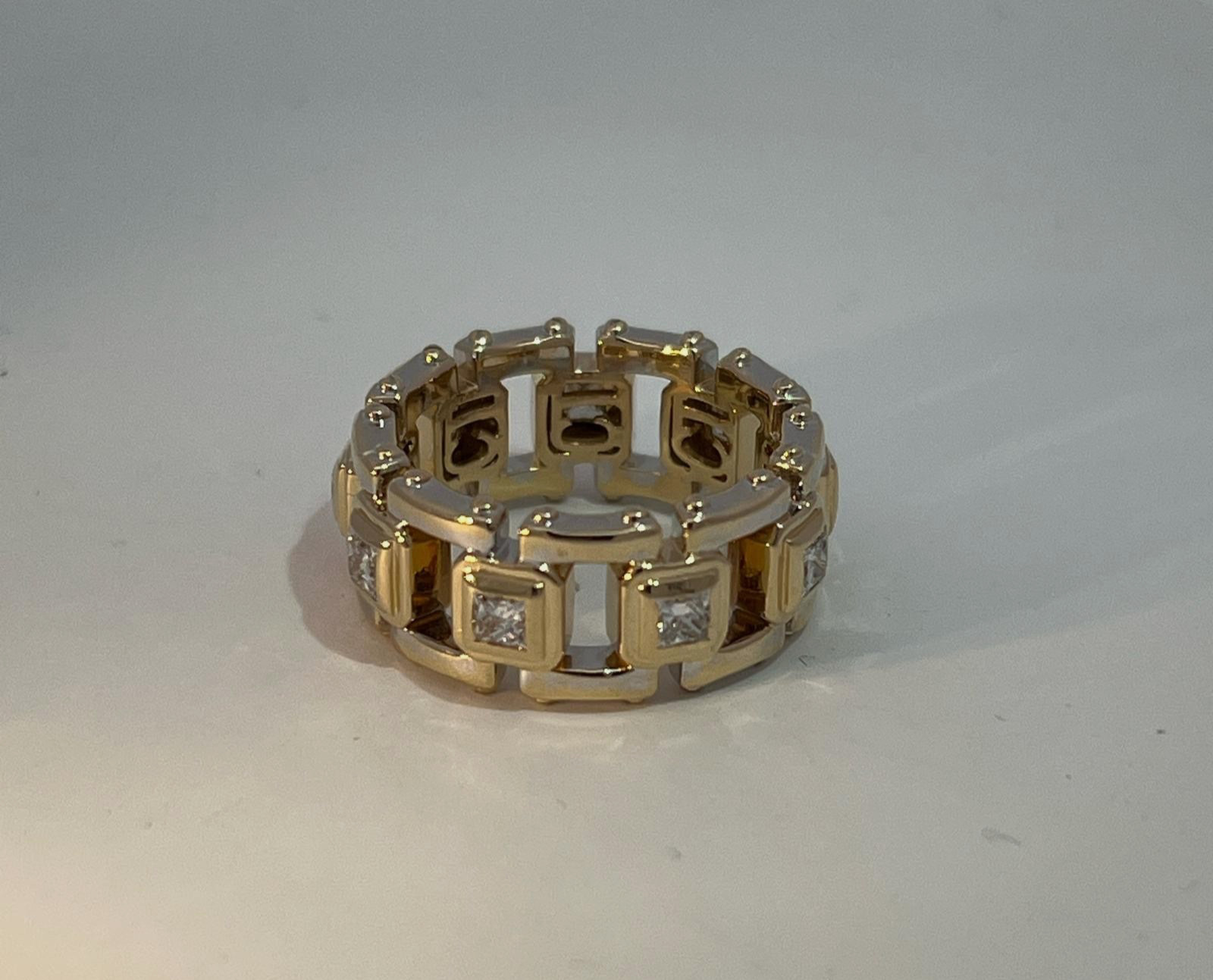 A 14k Modern Gold Link Band Featuring Princess Cut Diamond Accents