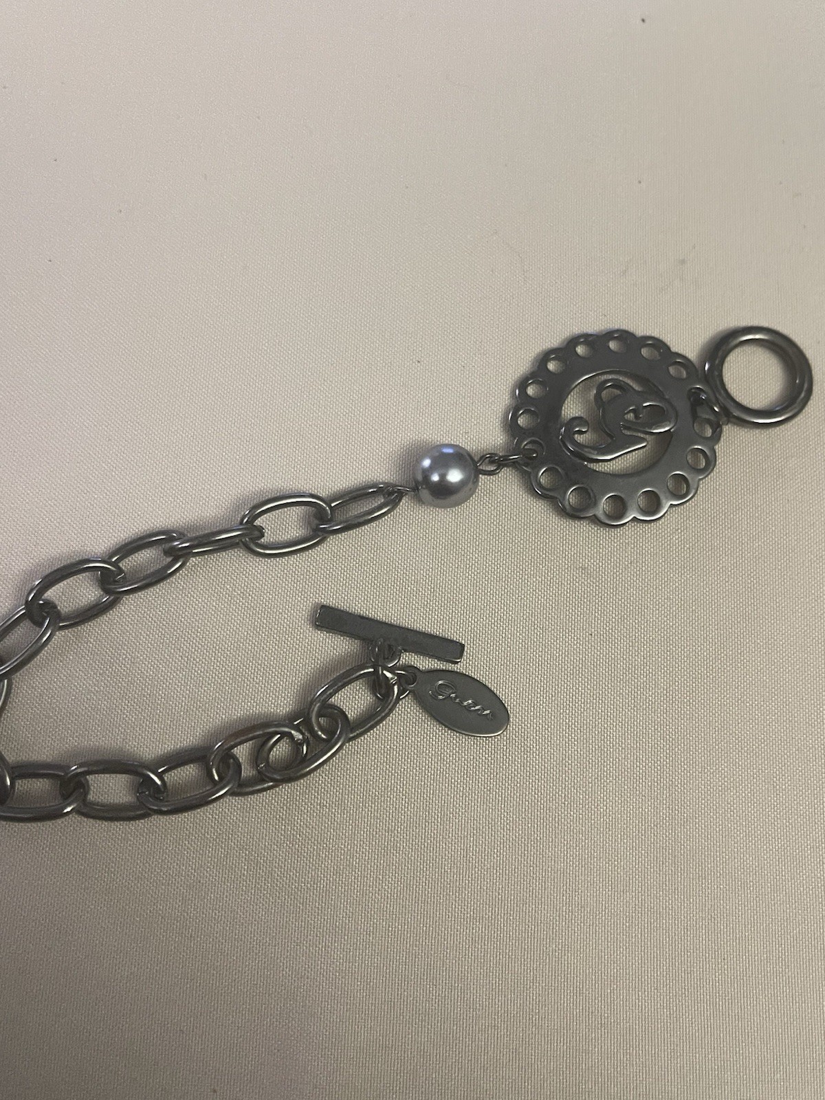 Guess Signed Silver Tone Oval Link Chain Charm Toggle Bracelet 7in