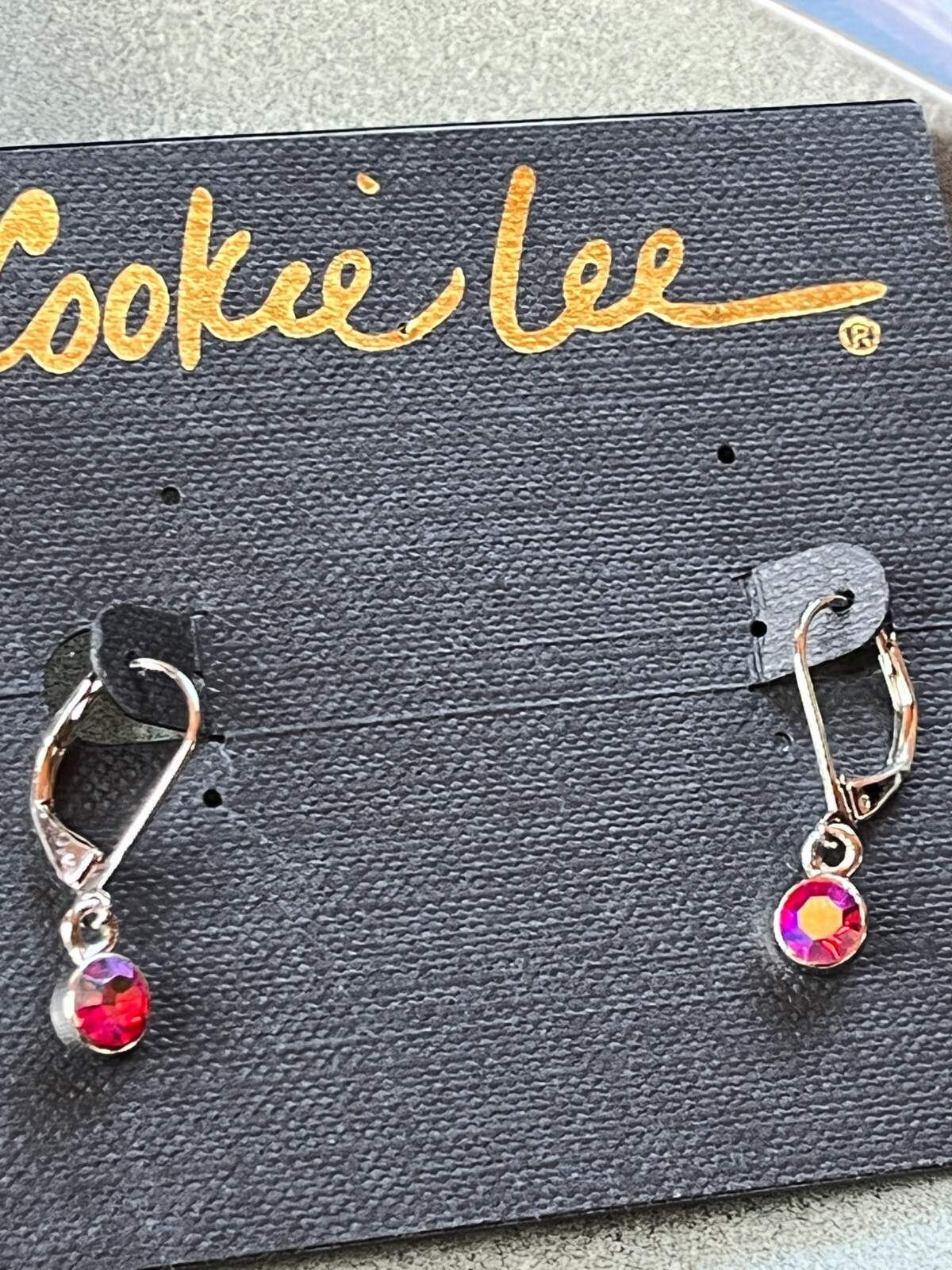 Cookie Lee Small Round Red Aurora Borealis Rhinestone in Silvertone Frame Dangle