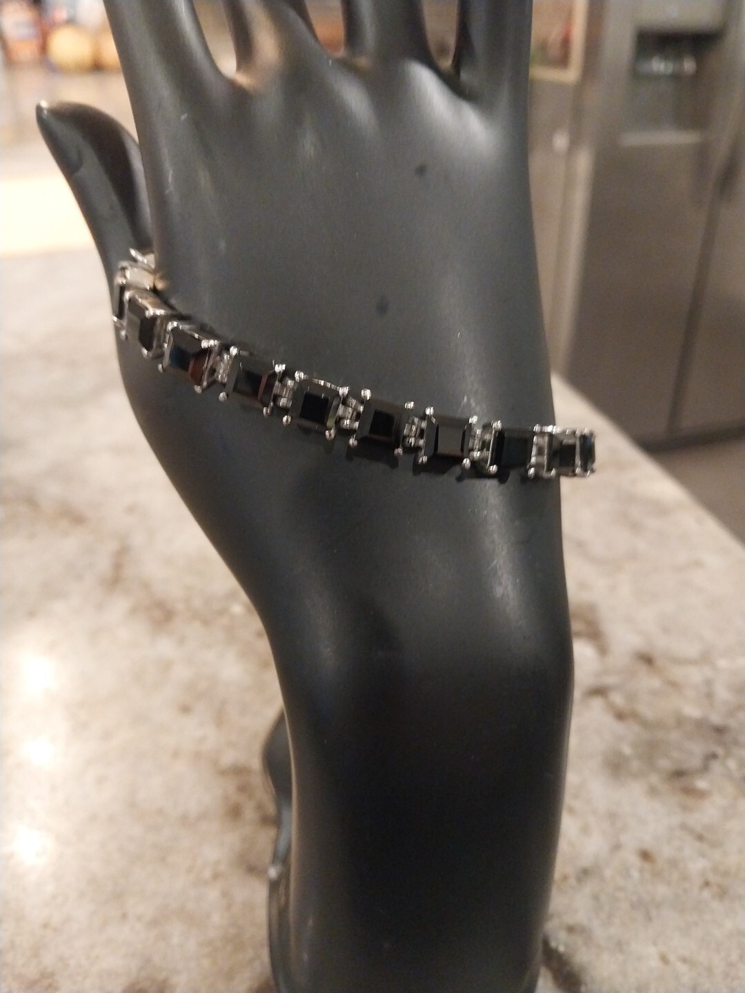THAI BLACK SPINEL(6X6MM CUSHION CUTS) BRACELET(28.50 TCW) 6.5-8.0″/STNLESS STEEL