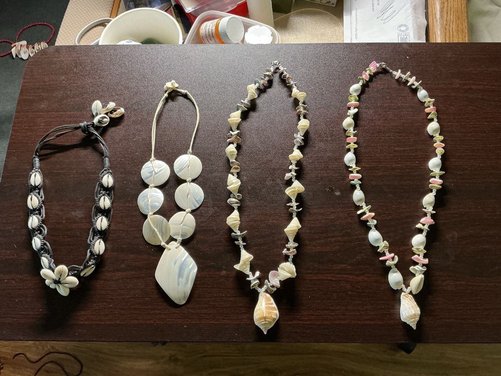 Lot Of 4 cute cowrie conch mother of pearl Seashell Necklaces, barely worn