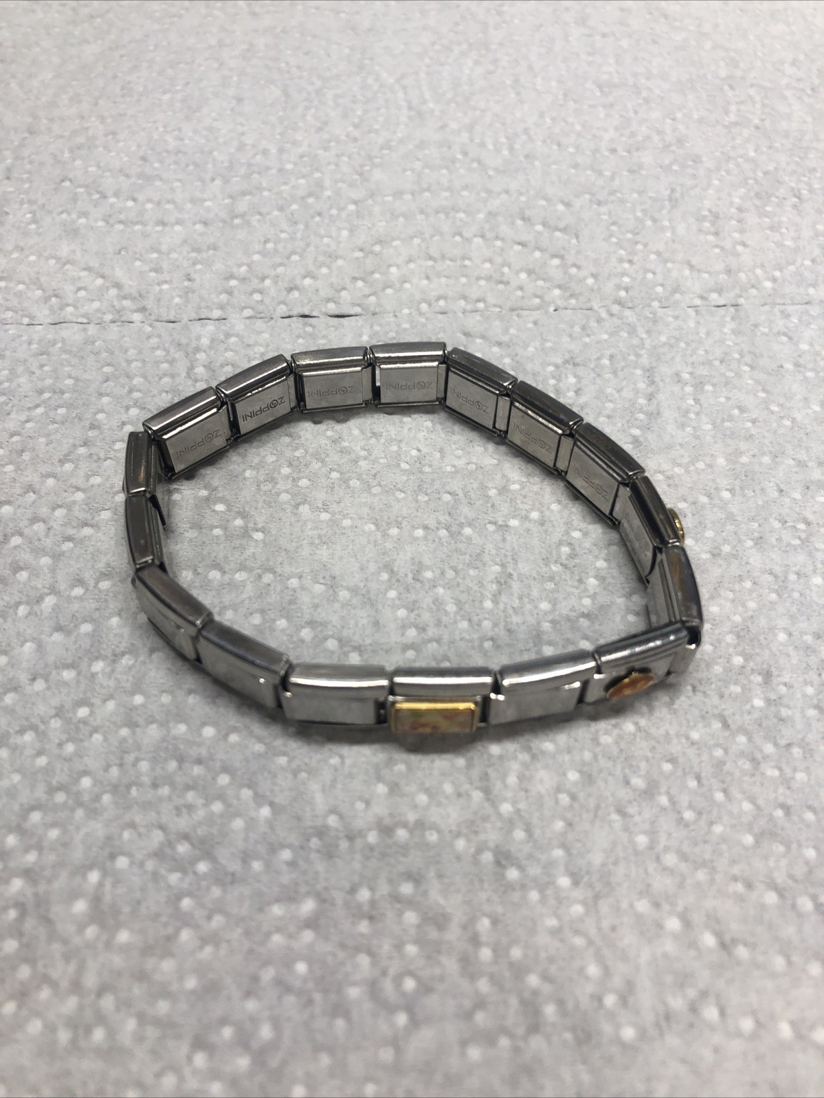 2003- CASA D’ORO ITALIAN STAINLESS STEEL 17 CHARM LINKS STRETCH BRACELET