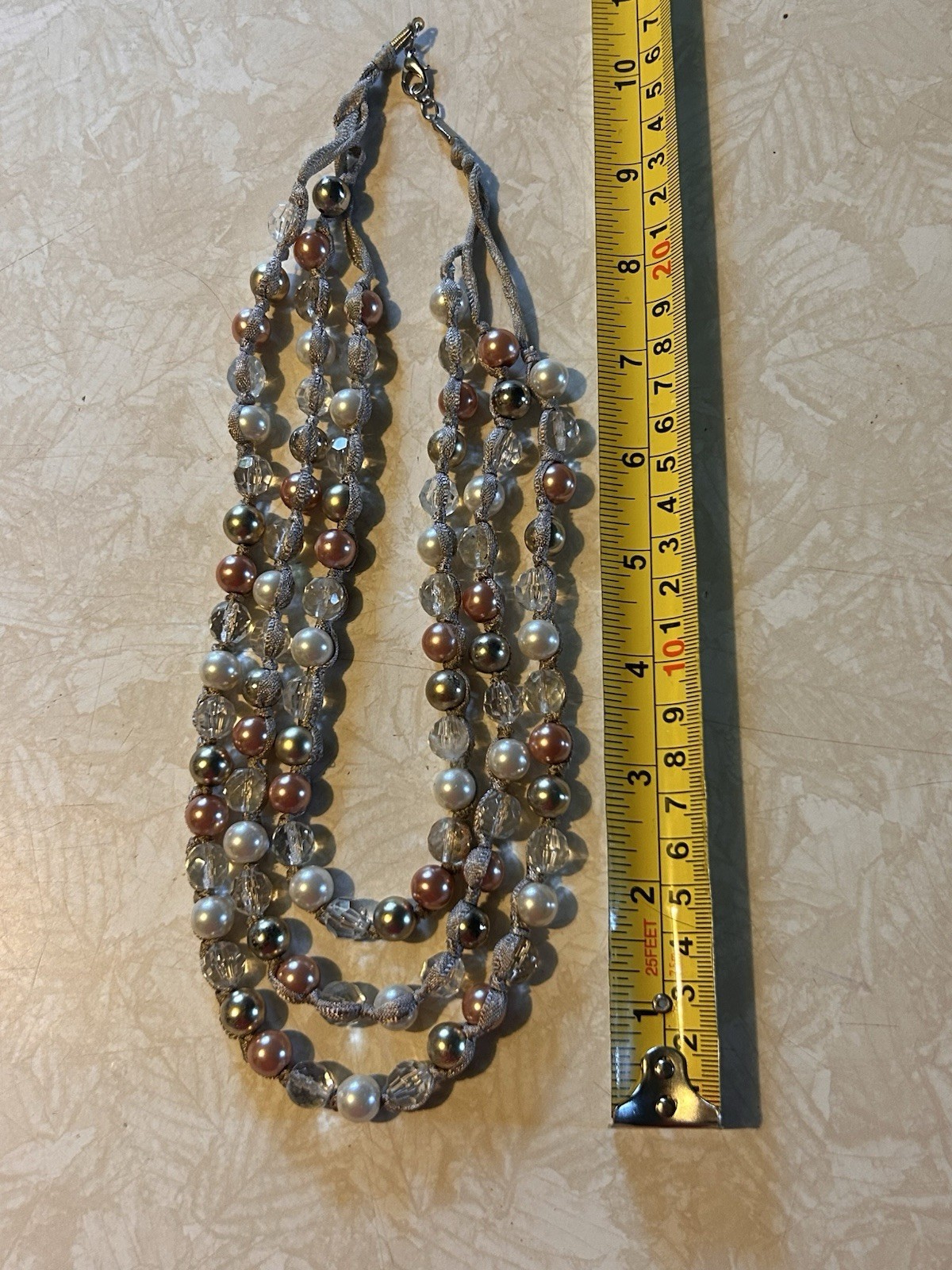 Necklace with multi strands of faux pearls and translucent beads. T60
