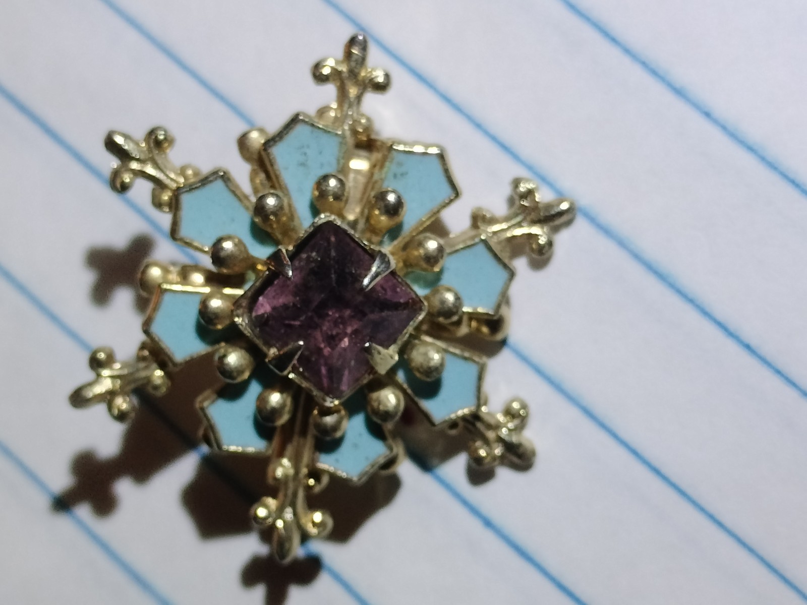 Gold Tone Metal Snowflake Pin Brooch with Blue Enamel & Purple Square Stone