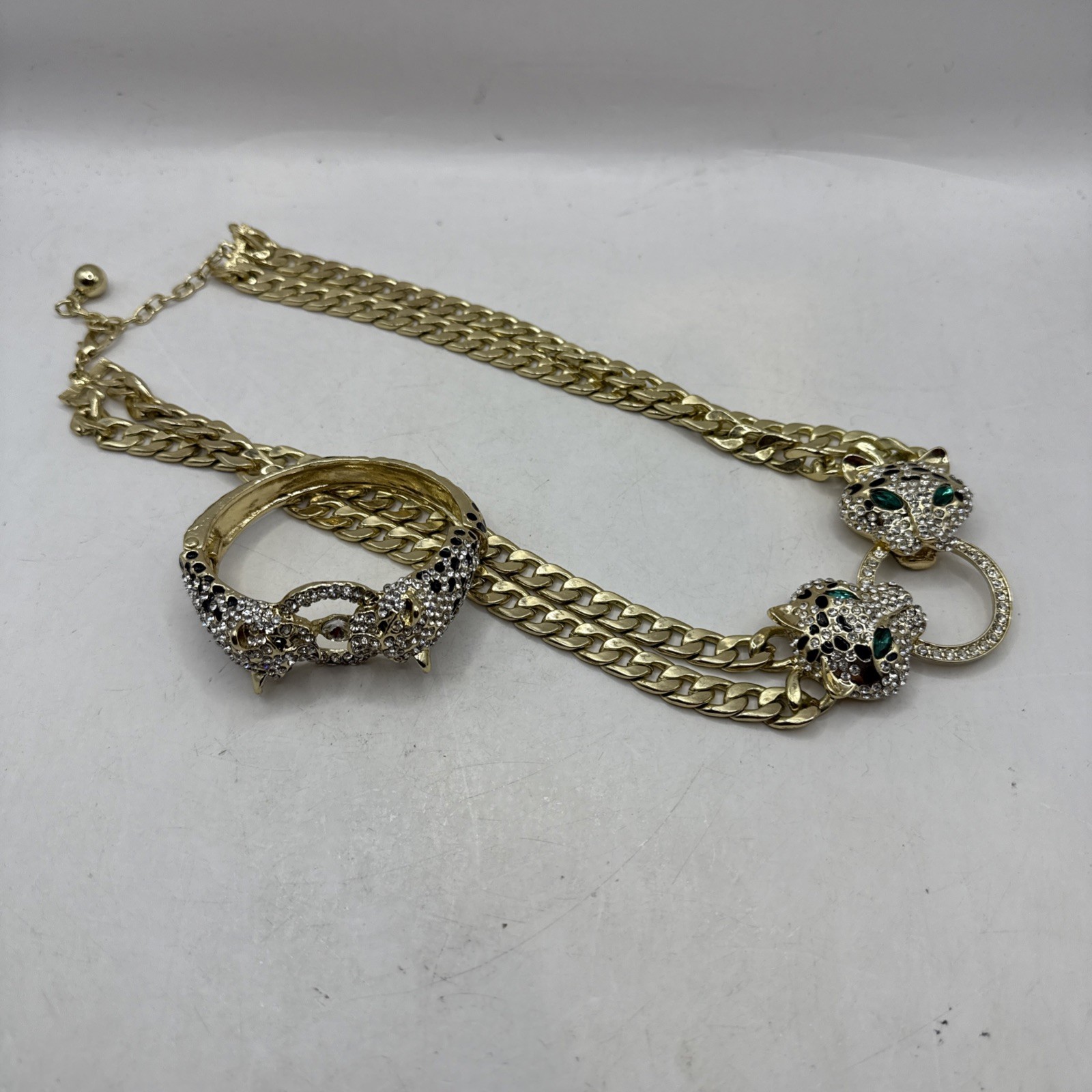 2.72 Cttw. Pave Crystal and Simulated Emerald Goldtone Leopard 2-Piece Set