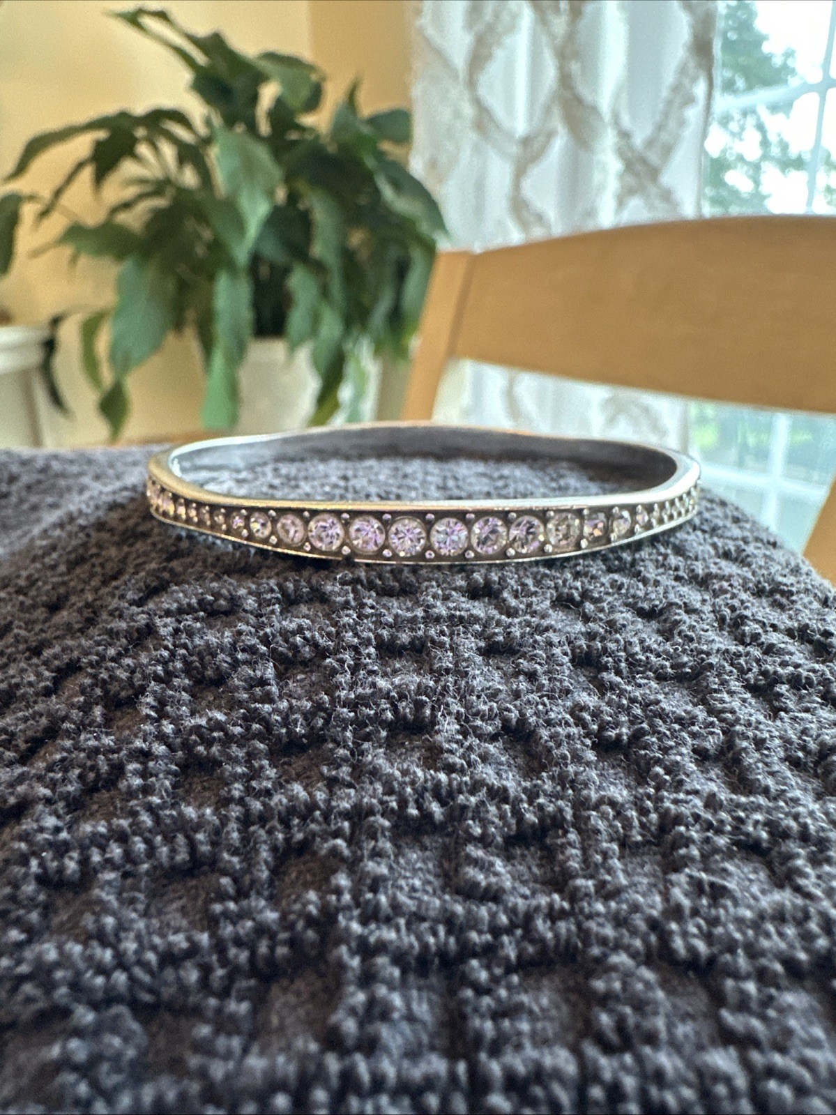 Brighton “Light Hearted” Bangle sparkling, varied-size crystal rhinestones.