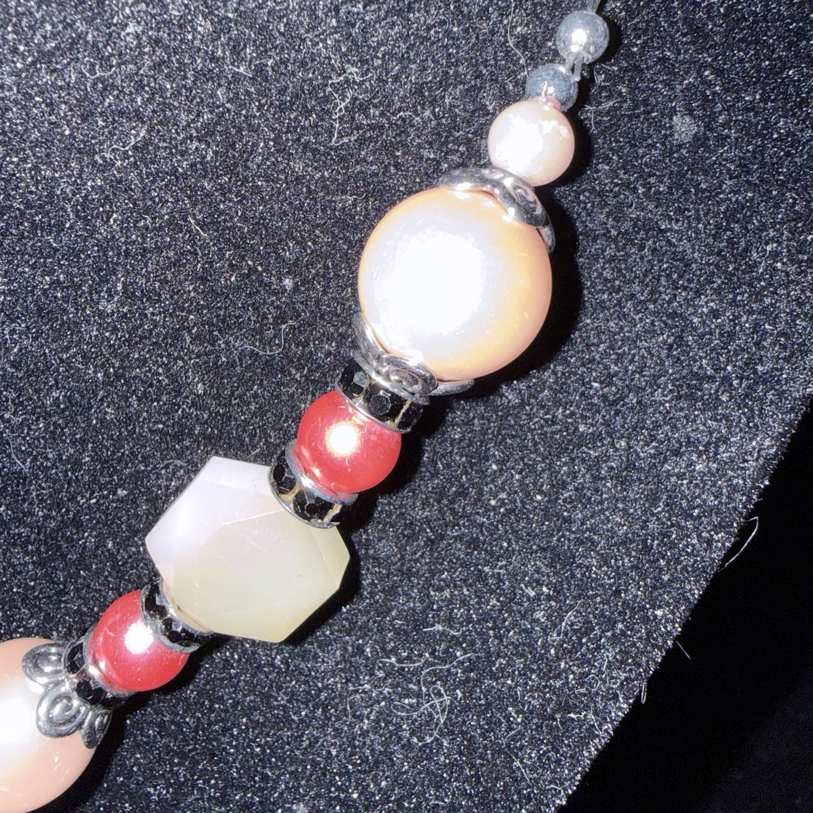 Silver tone red & white beaded necklace w/ orange rectangle charm, adjustable
