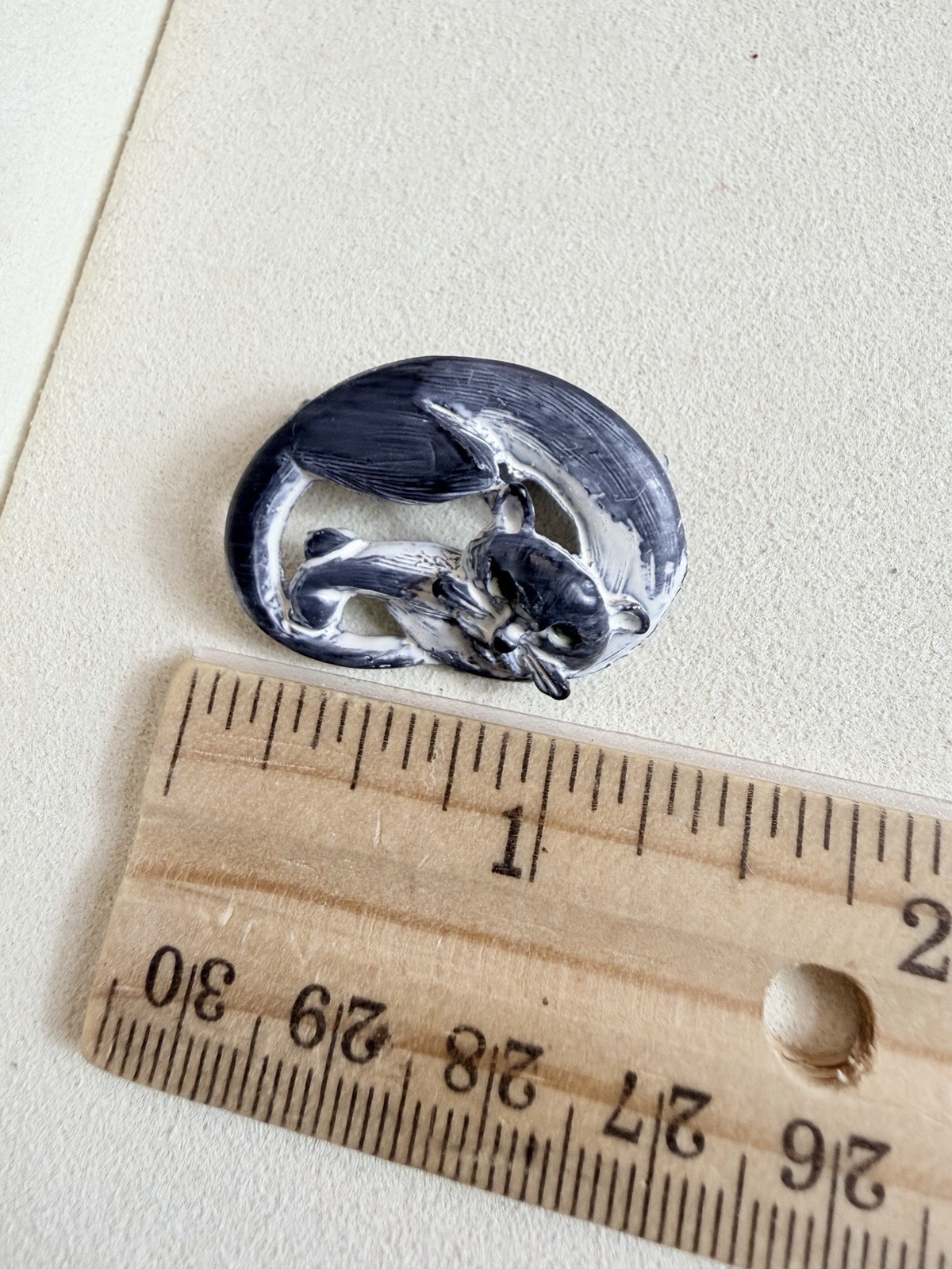 Vintage brooch clay sleeping cat with a brushed black and white finish