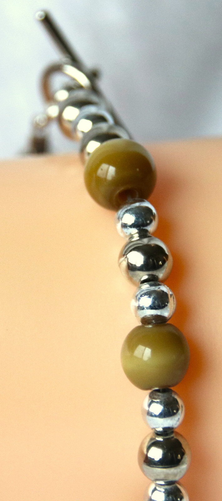 Bracelet of Brown Cat’s Eye Glass with silver colored beads, toggle closure