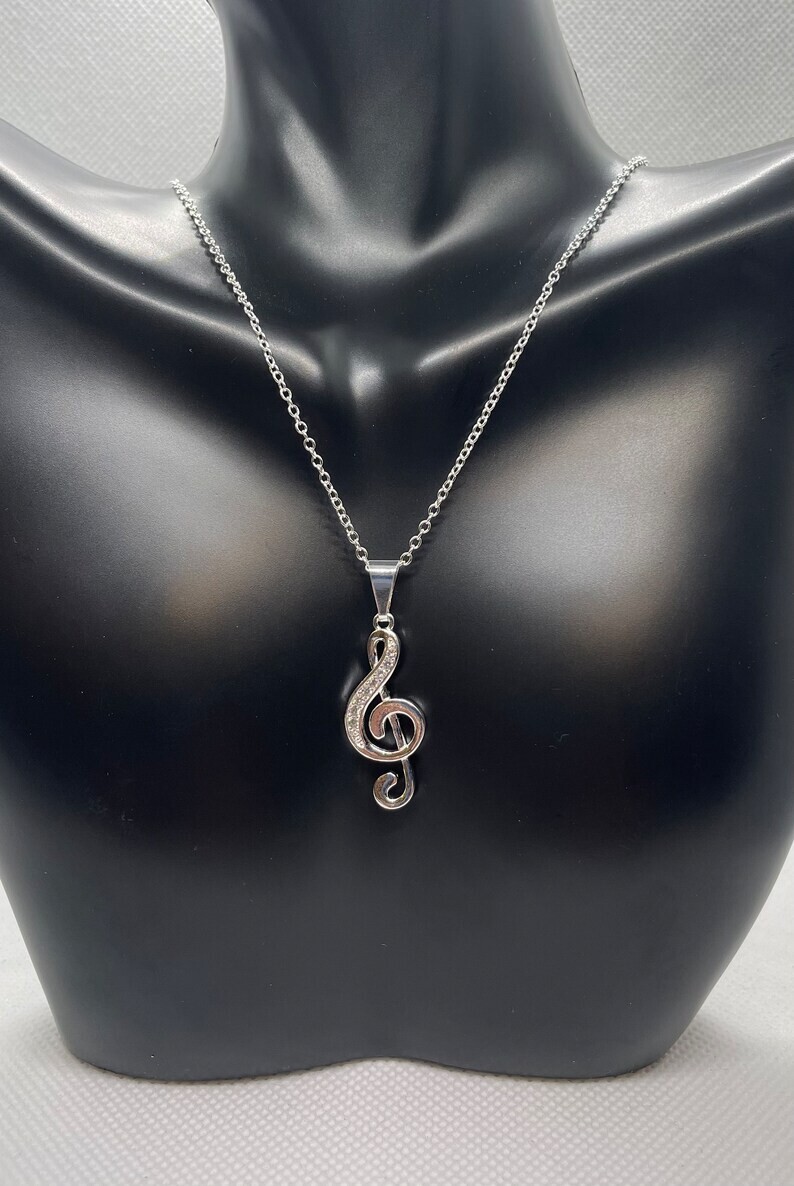 Treble musical note necklace pendant with simulated diamonds