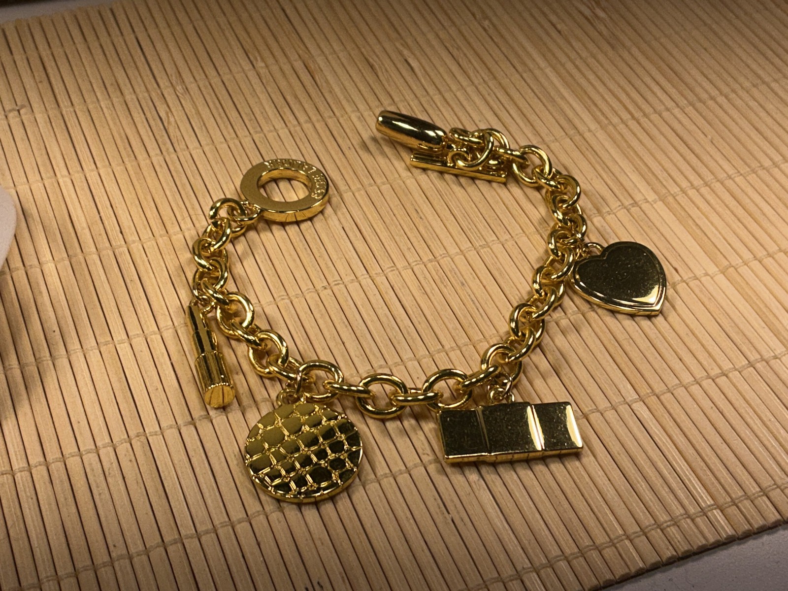 Estee Lauder Bracelet Cast Gold Tone Charms Heart Lipstick Perfume Purse Lot 90A