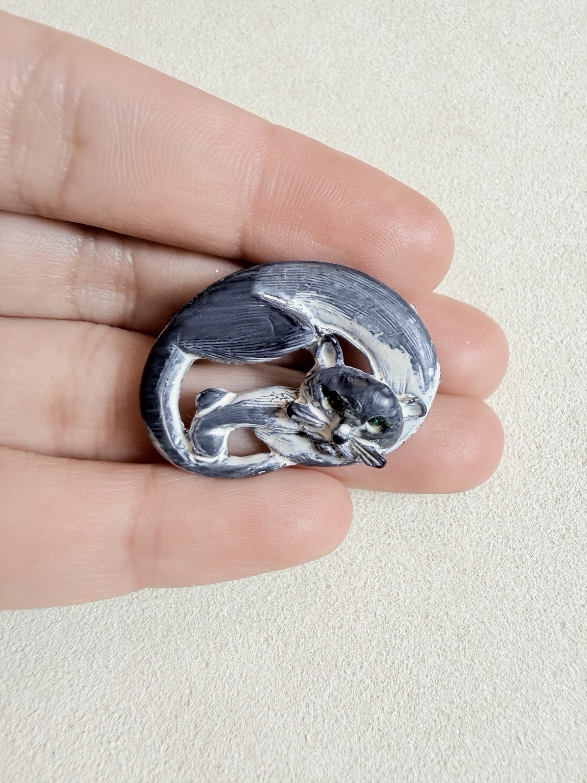 Vintage brooch clay sleeping cat with a brushed black and white finish