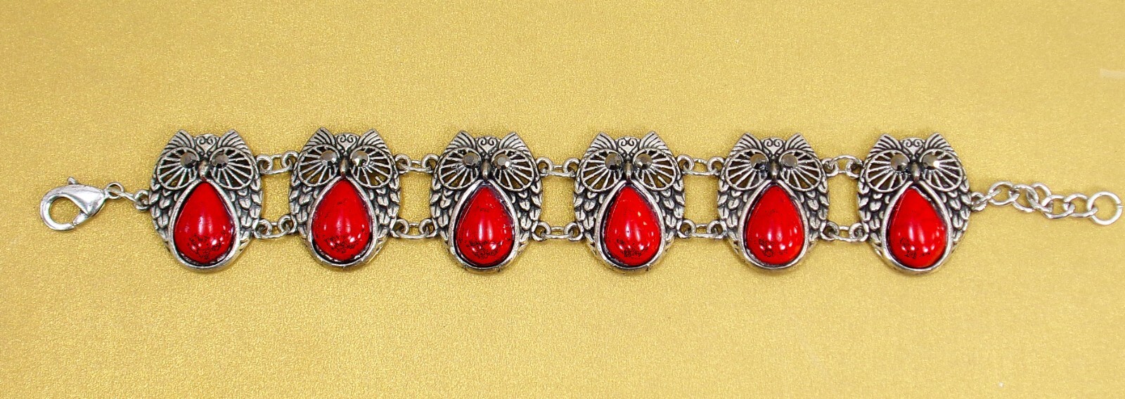 Owl bracelet made with red beads, gray crystal eyes in silver antique finish New