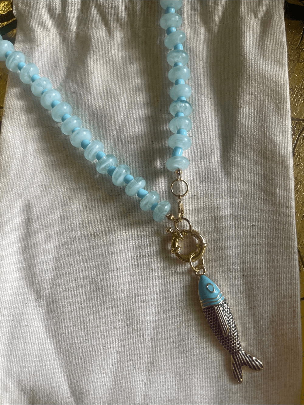 Light Blue Beaded Necklace with Fish Pendant