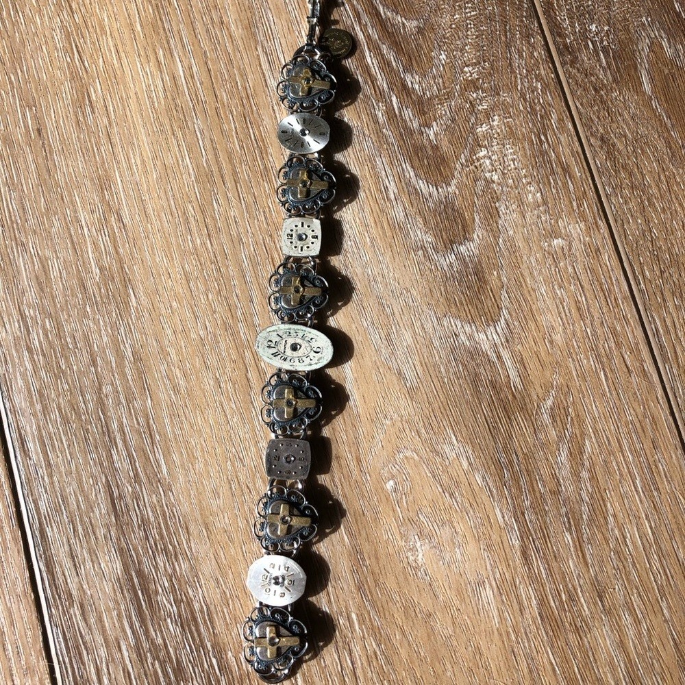 Artistic Silver and Gold Watch Face and Cross Bracelet