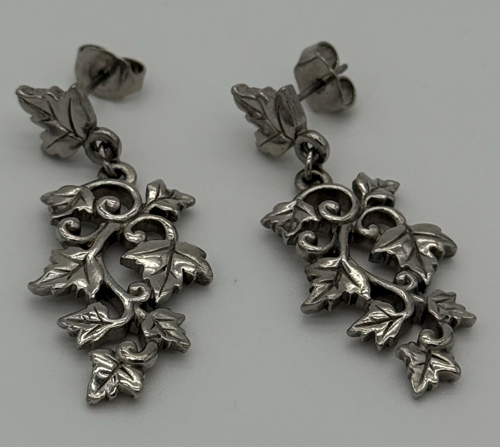 Grape Leaf Motif Dangle Earrings. Silver Tone.