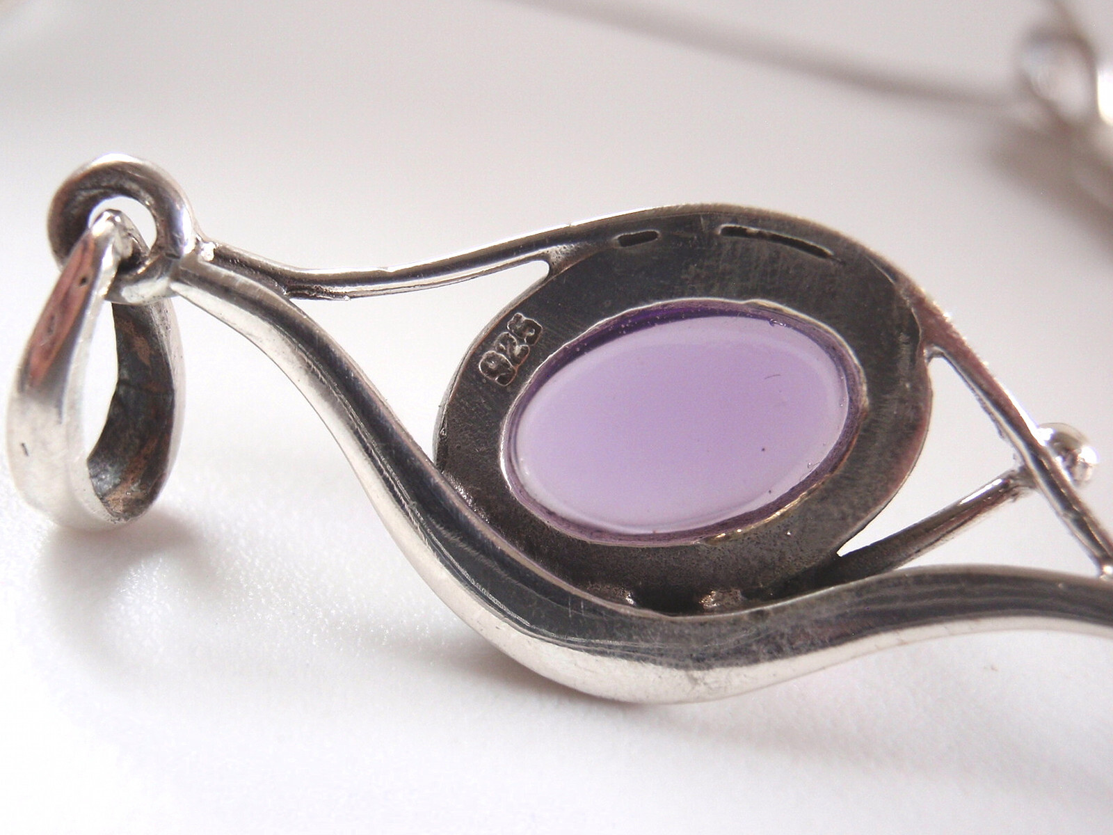 Simulated Amethyst Framed in Curves 925 Sterling Silver Pendant
