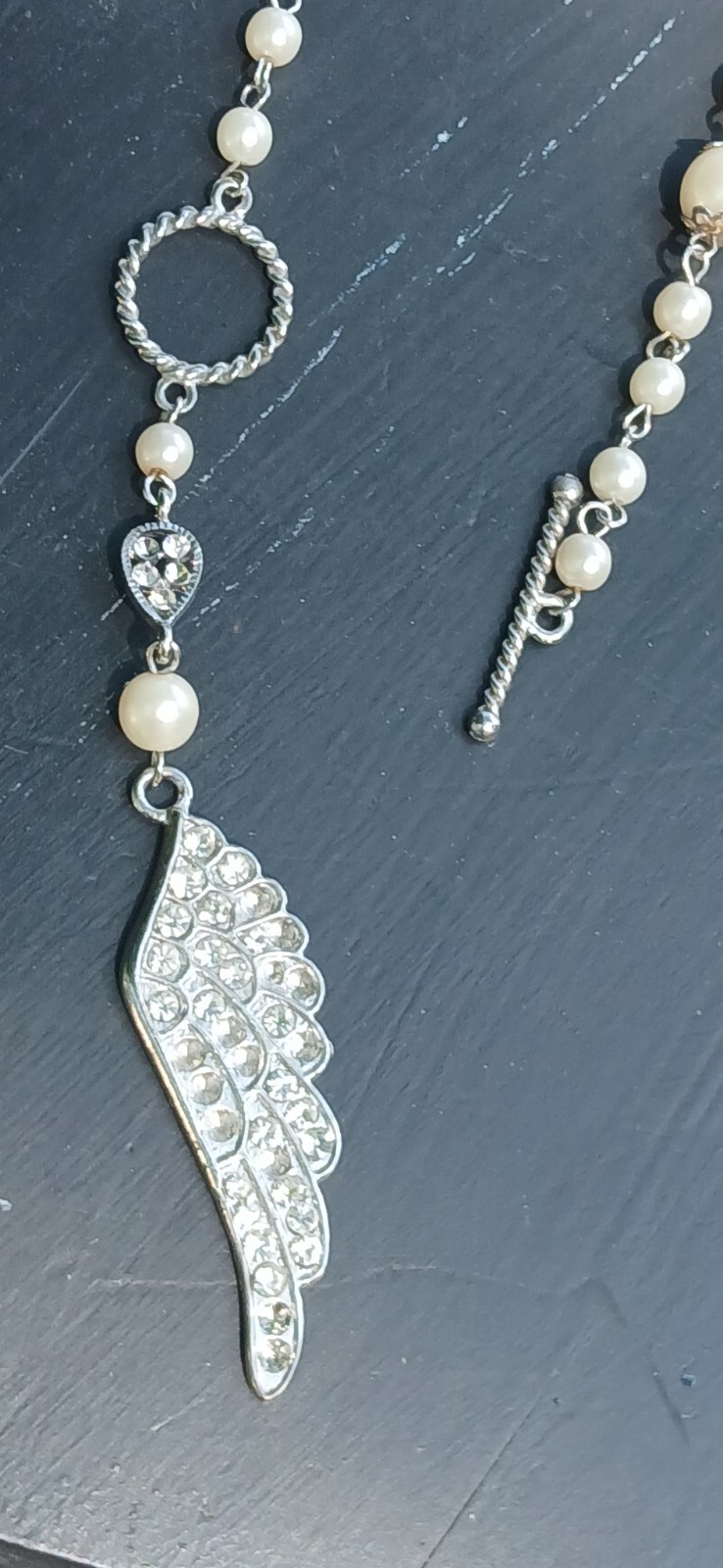 Silver Tone Ivory Faux Pearl Necklace Rhinestone Pavé Angel Wing Charm Toggle