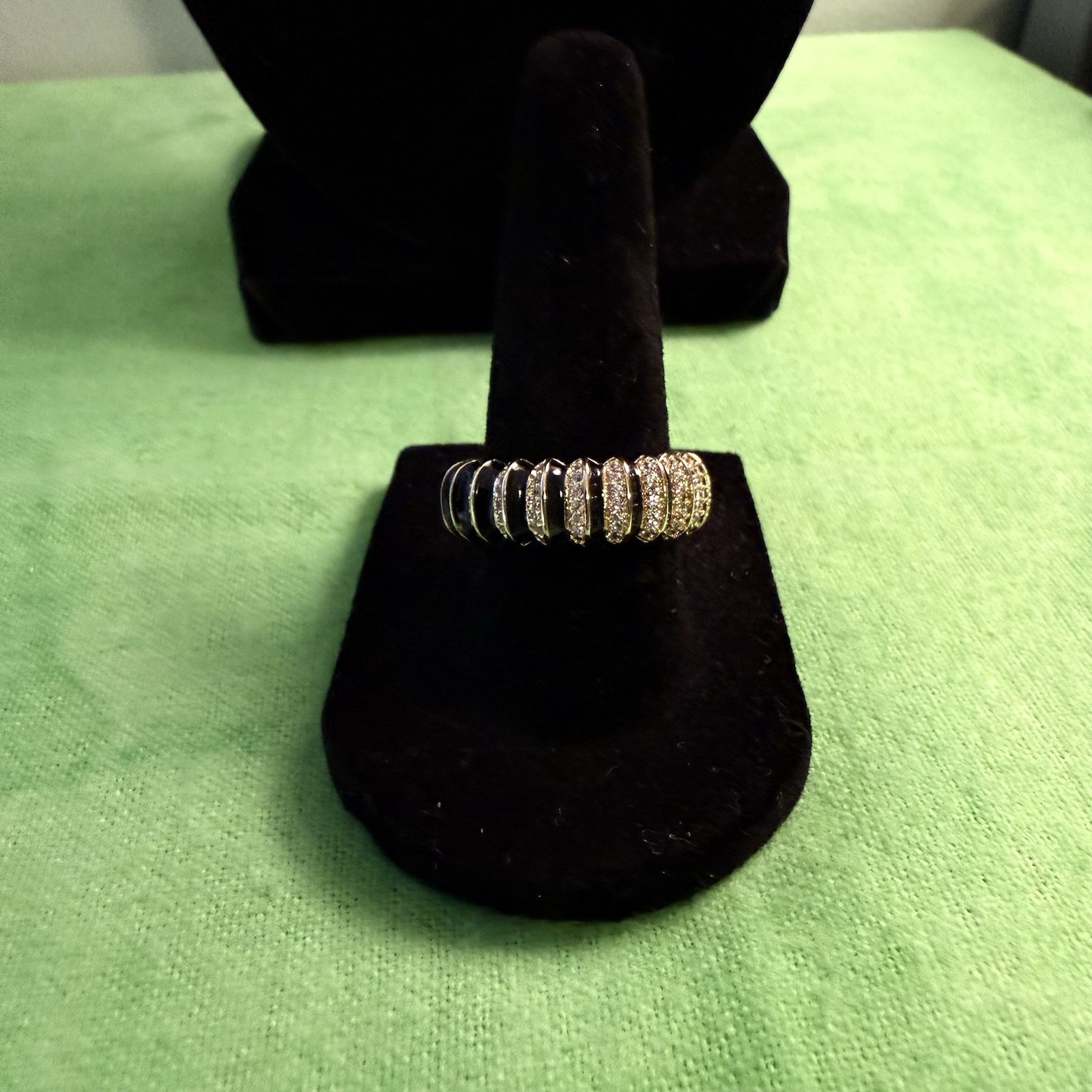 Sim. Diam. Eter. Ring In Goldtone. Blk. Enam. The Ring Is A Size 8. 1.10 Ctw
