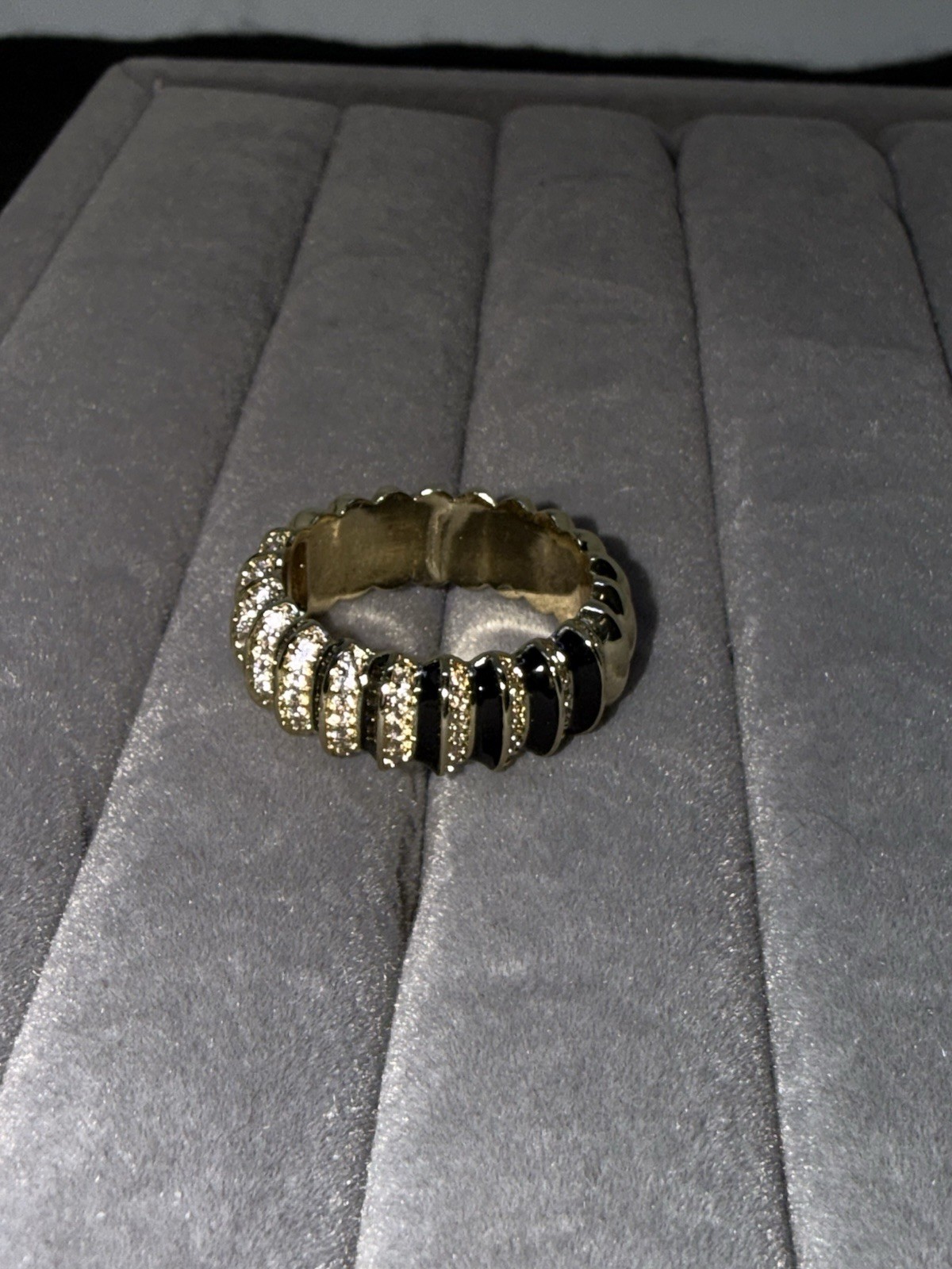 Sim. Diam. Eter. Ring In Goldtone. Blk. Enam. The Ring Is A Size 8. 1.10 Ctw