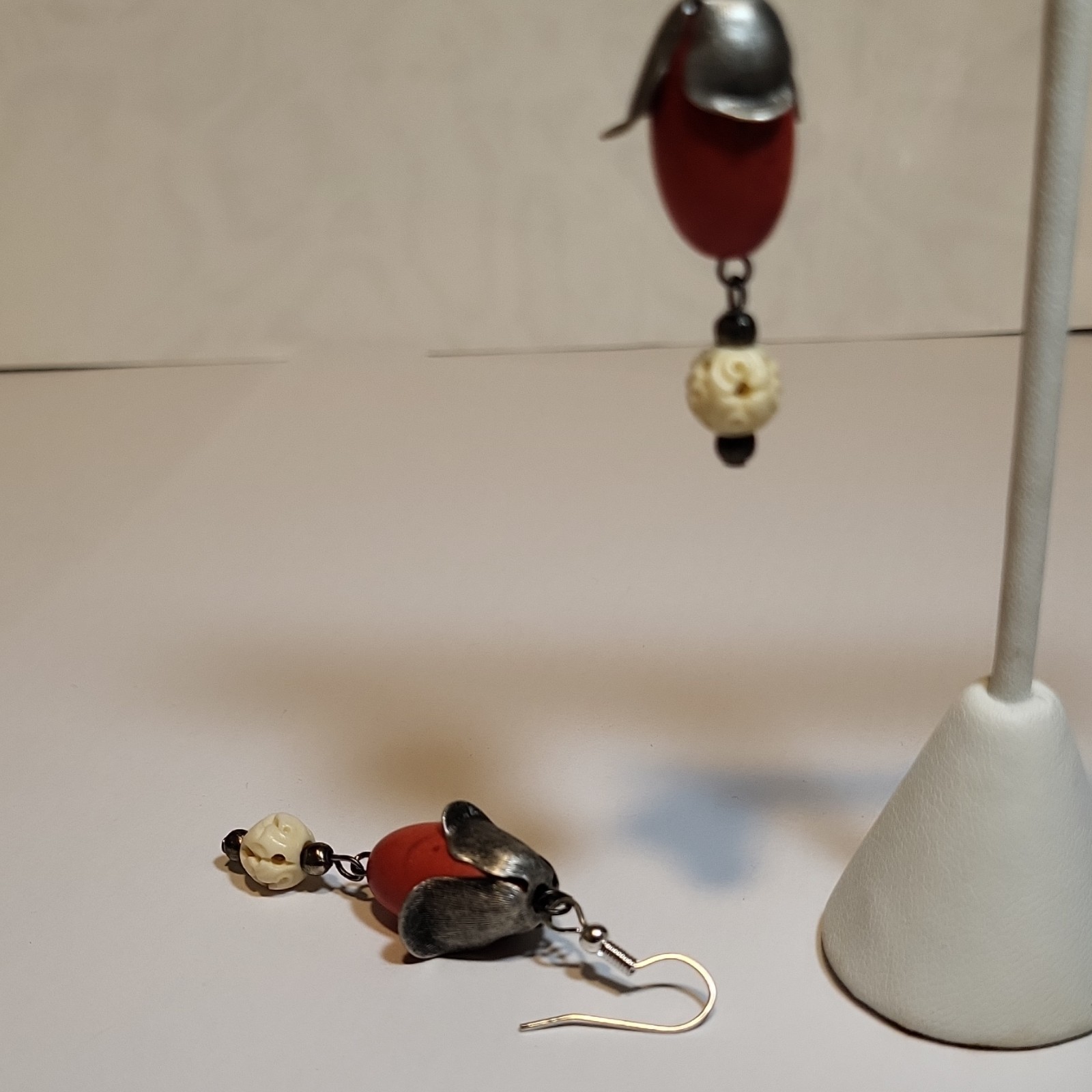 Handcrafted dangle earring featuring a large red coral Seed & Ivory Bead.