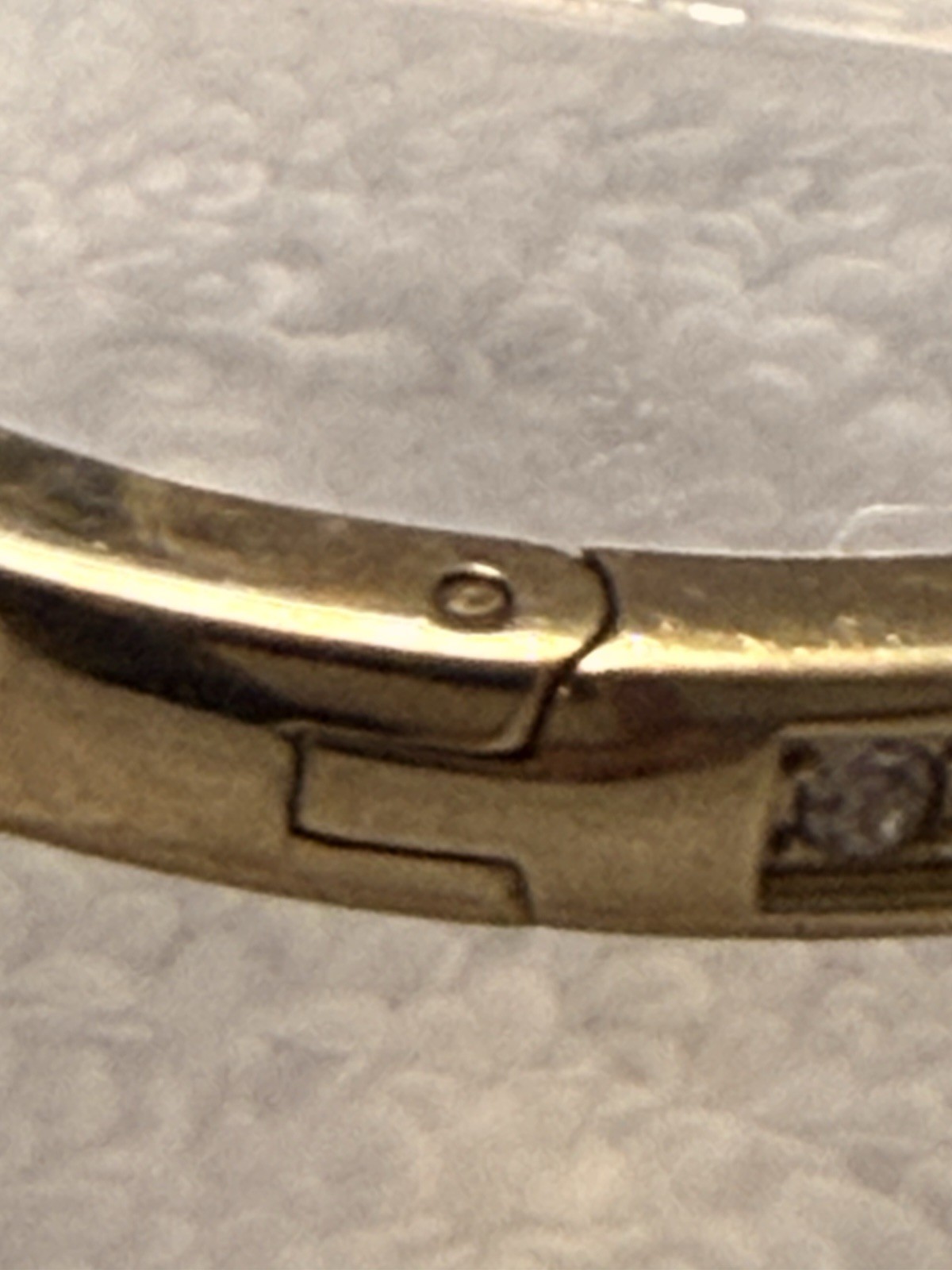 Fossil Brand Gold tone latch closure bangle with white stones