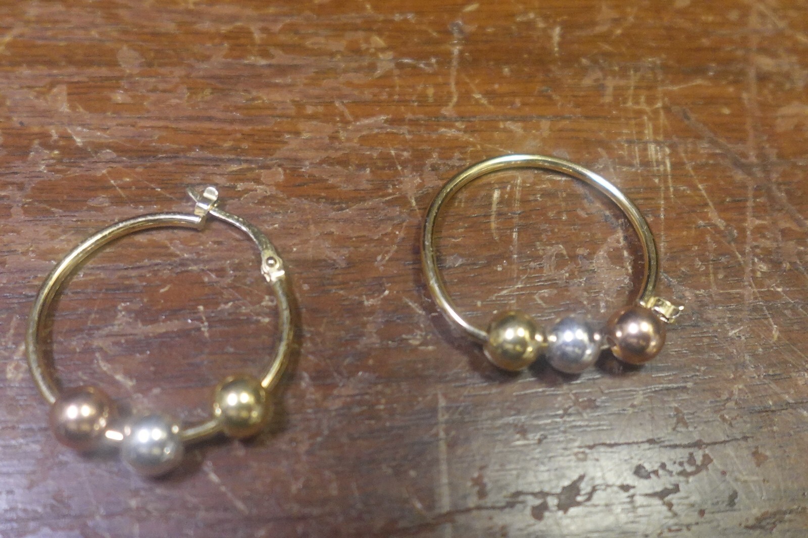 PAIR OF GOLD COLOR EARRINGS W ROUND MARKED JCM OR TCM 925 LOT 14
